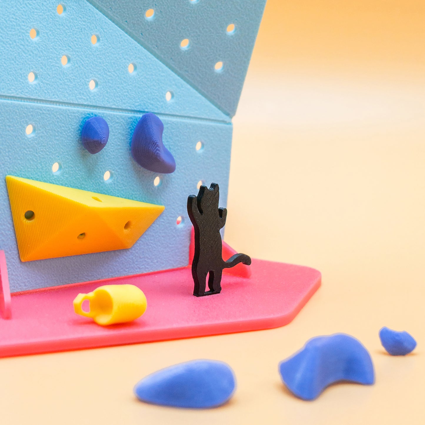 A DIY mini black cat rock climbing wall kit – a playful, creative gift for climbers and boulderers who love handmade decor. Designed by Non Vertical Lab. A perfect collectible for climbing enthusiasts and a fun gift for all ages.