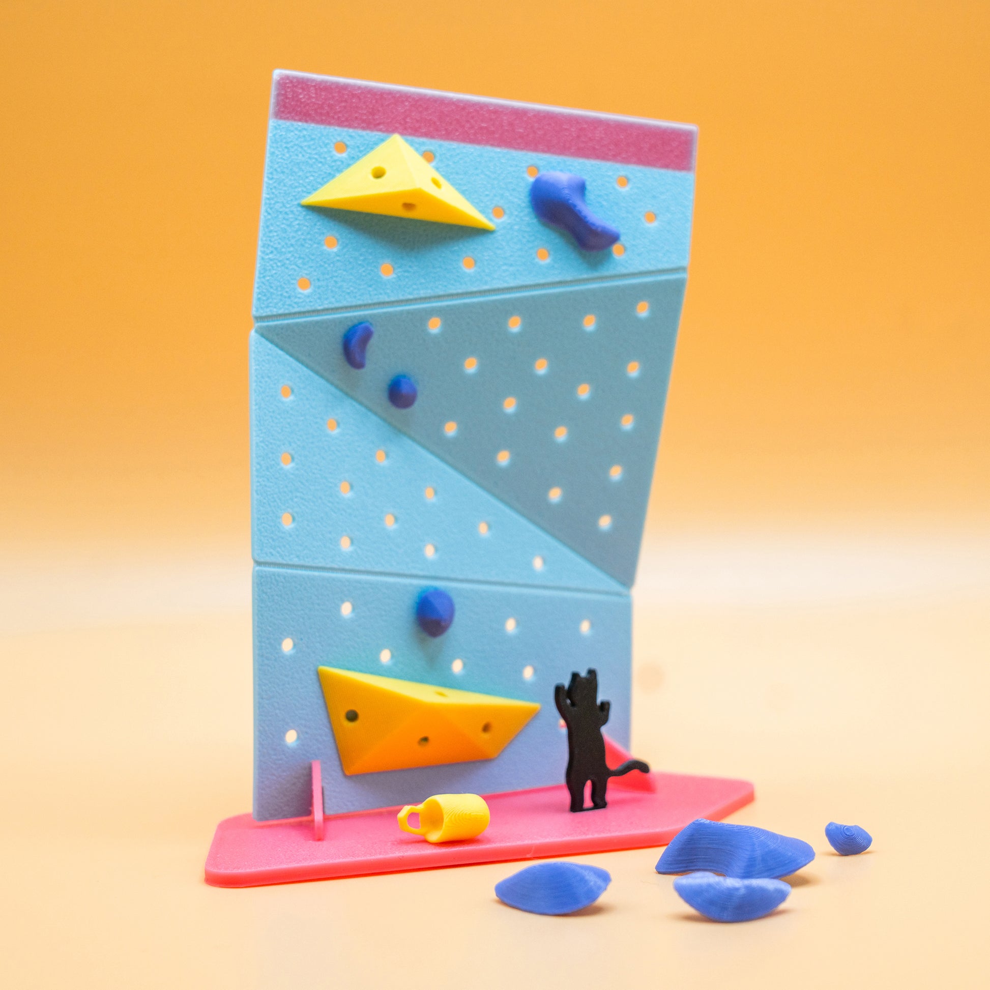 A DIY mini black cat rock climbing wall kit – a playful, creative gift for climbers and boulderers who love handmade decor. Designed by Non Vertical Lab. A perfect collectible for climbing enthusiasts and a fun gift for all ages.