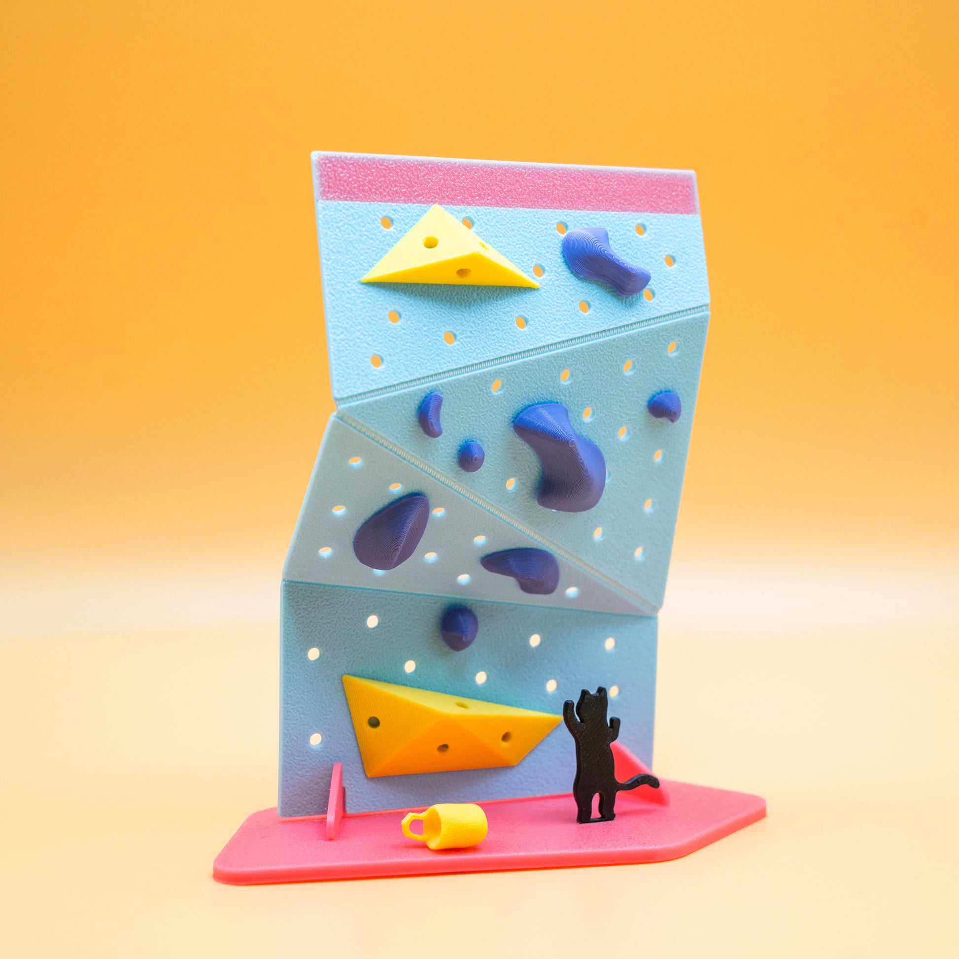 A DIY mini black cat rock climbing wall kit – a playful, creative gift for climbers and boulderers who love handmade decor. Designed by Non Vertical Lab. A perfect collectible for climbing enthusiasts and a fun gift for all ages.