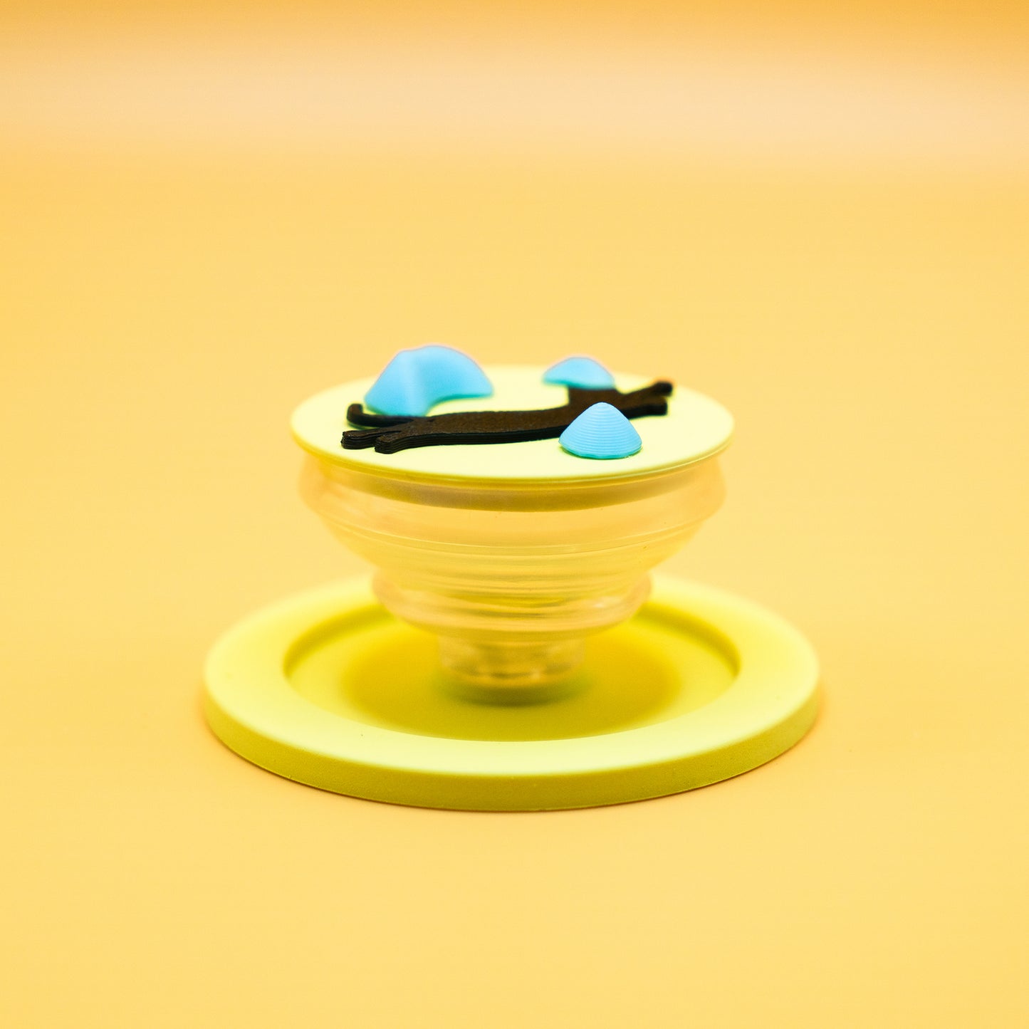 A black cat in mid-air dyno motion, leaping toward climbing holds – printed on a MagSafe phone grip. A bold gift for climbers and cat lovers. Designed by Non Vertical Lab.