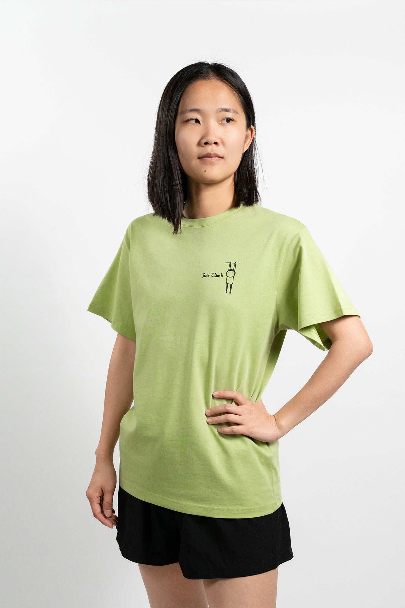 “Just Climb” graphic T-shirt featuring a cute cat and climbing elements – a fun and bold gift for rock climbers.