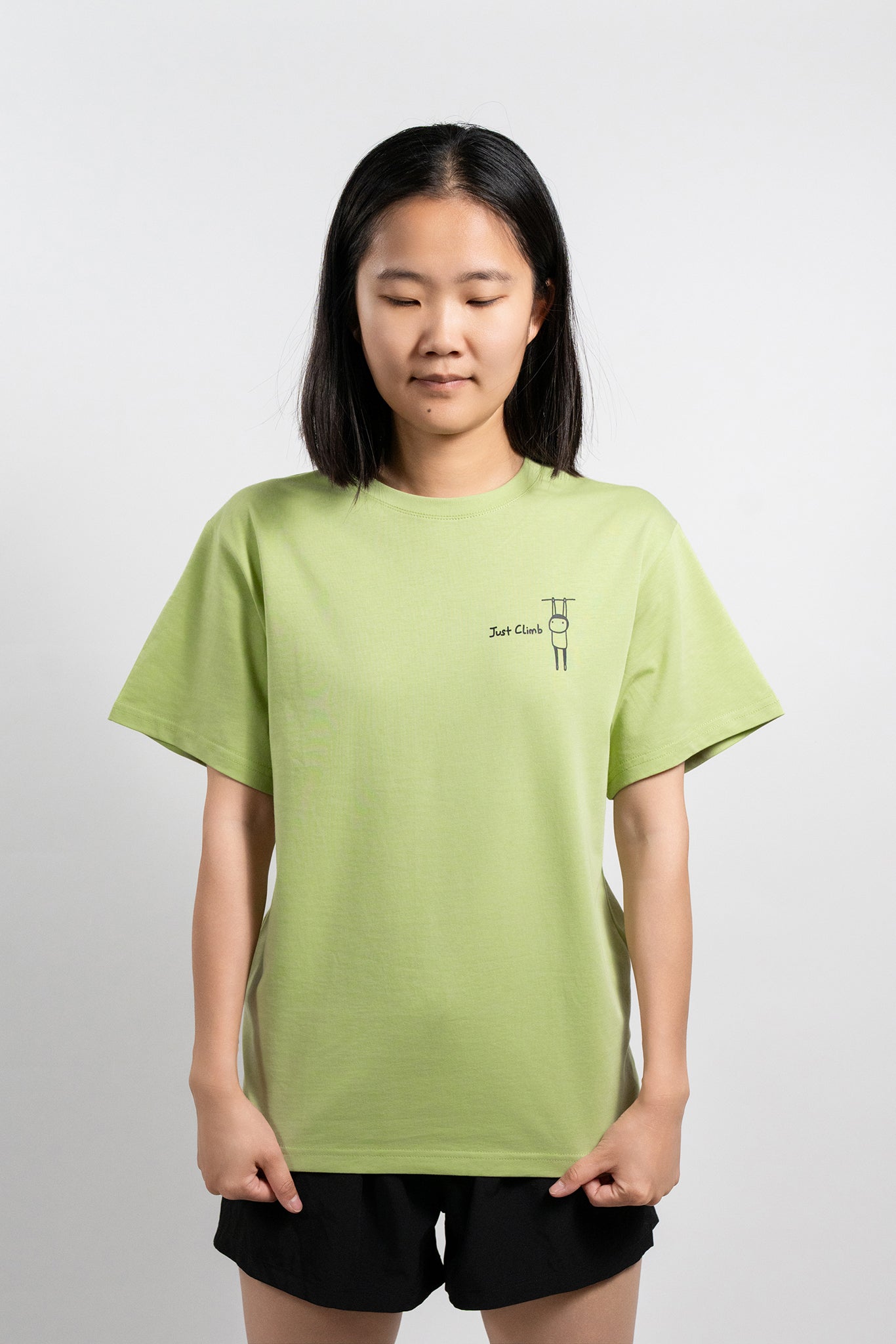“Just Climb” graphic T-shirt featuring a cute cat and climbing elements – a fun and bold gift for rock climbers.