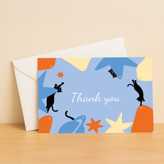Black Cat drifting across a cosmic climbing wall made of glowing planets – a magical thank you card for dreamers, climbers, and cat lovers.