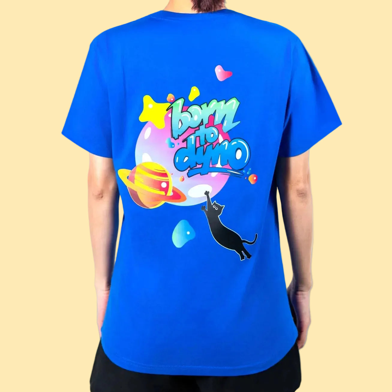 Person wearing a blue t-shirt with colorful graphics and text Born to Dyno on the back