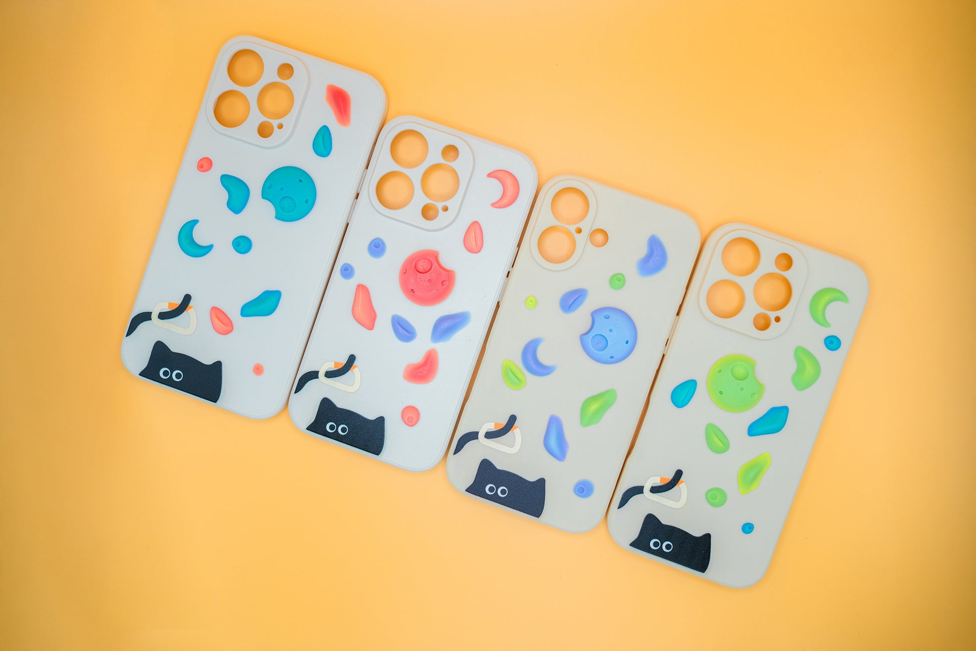 A black cat with a carabiner hanging from its tail, surrounded by colorful climbing holds – printed on a playful iPhone case. A fun gift for rock climbers and cat lovers.