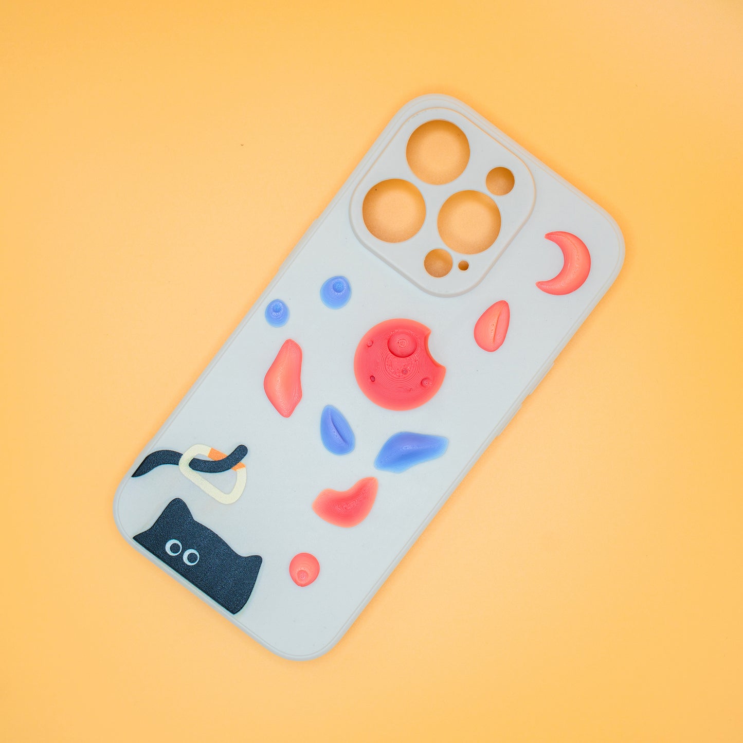 A black cat with a carabiner hanging from its tail, surrounded by colorful climbing holds – printed on a playful iPhone case. A fun gift for rock climbers and cat lovers.
