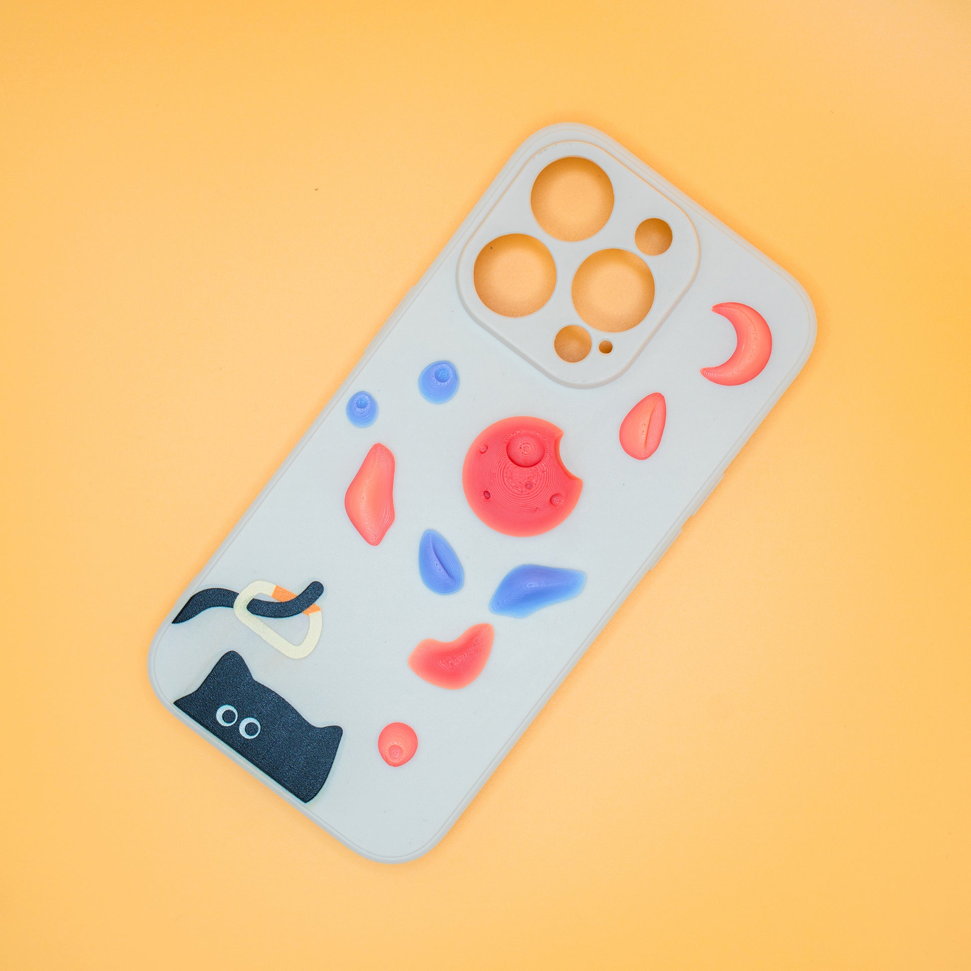 A black cat with a carabiner hanging from its tail, surrounded by colorful climbing holds – printed on a playful iPhone case. A fun gift for rock climbers and cat lovers.