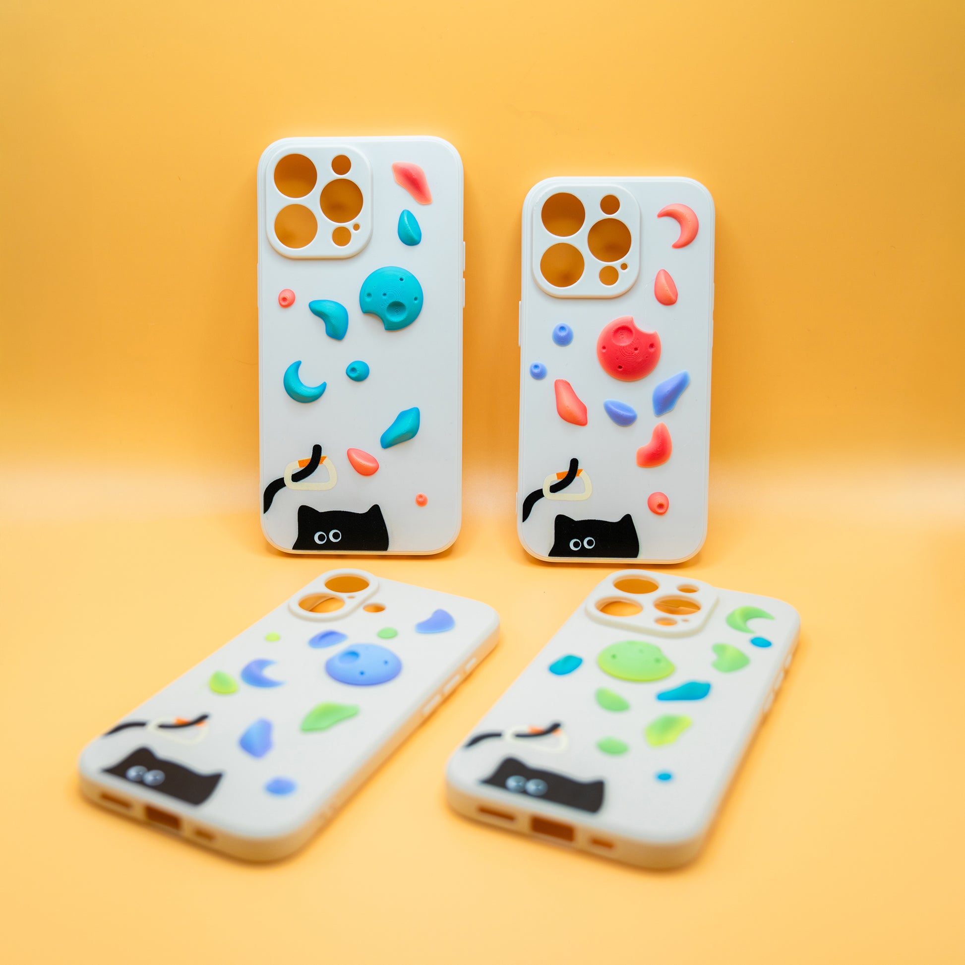 A black cat with a carabiner hanging from its tail, surrounded by colorful climbing holds – printed on a playful iPhone case. A fun gift for rock climbers and cat lovers.