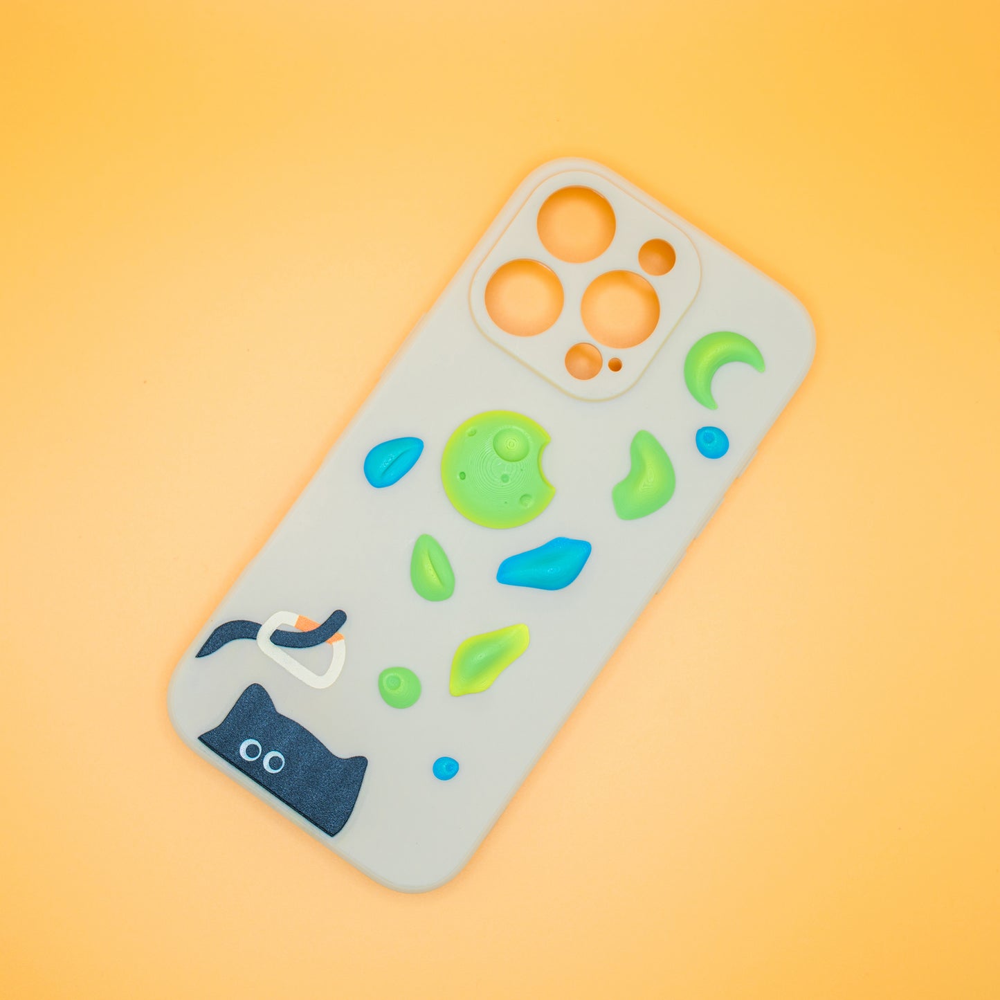 A black cat with a carabiner hanging from its tail, surrounded by colorful climbing holds – printed on a playful iPhone case. A fun gift for rock climbers and cat lovers.
