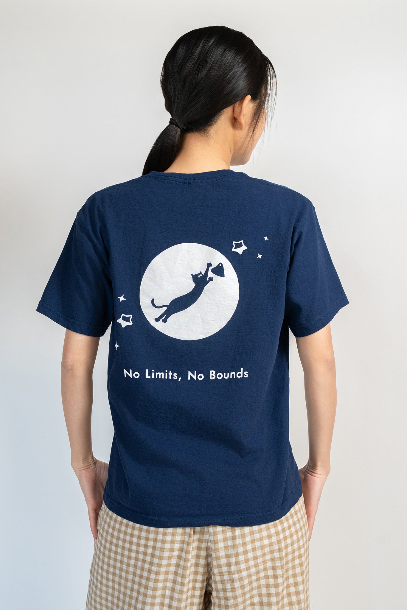 Cosmic Leap Cat T-Shirt featuring a black cat mid-leap across space – a climbing-inspired gift for dyno lovers and rock climbers.