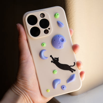 A black cat mid-dyno toward colorful climbing holds – printed on a fun and bold iPhone case. A great gift for climbers and cat lovers.