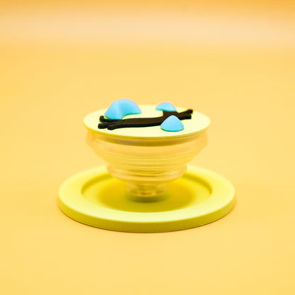 A black cat in mid-air dyno motion, leaping toward climbing holds – printed on a MagSafe phone grip. A bold gift for climbers and cat lovers. Designed by Non Vertical Lab.