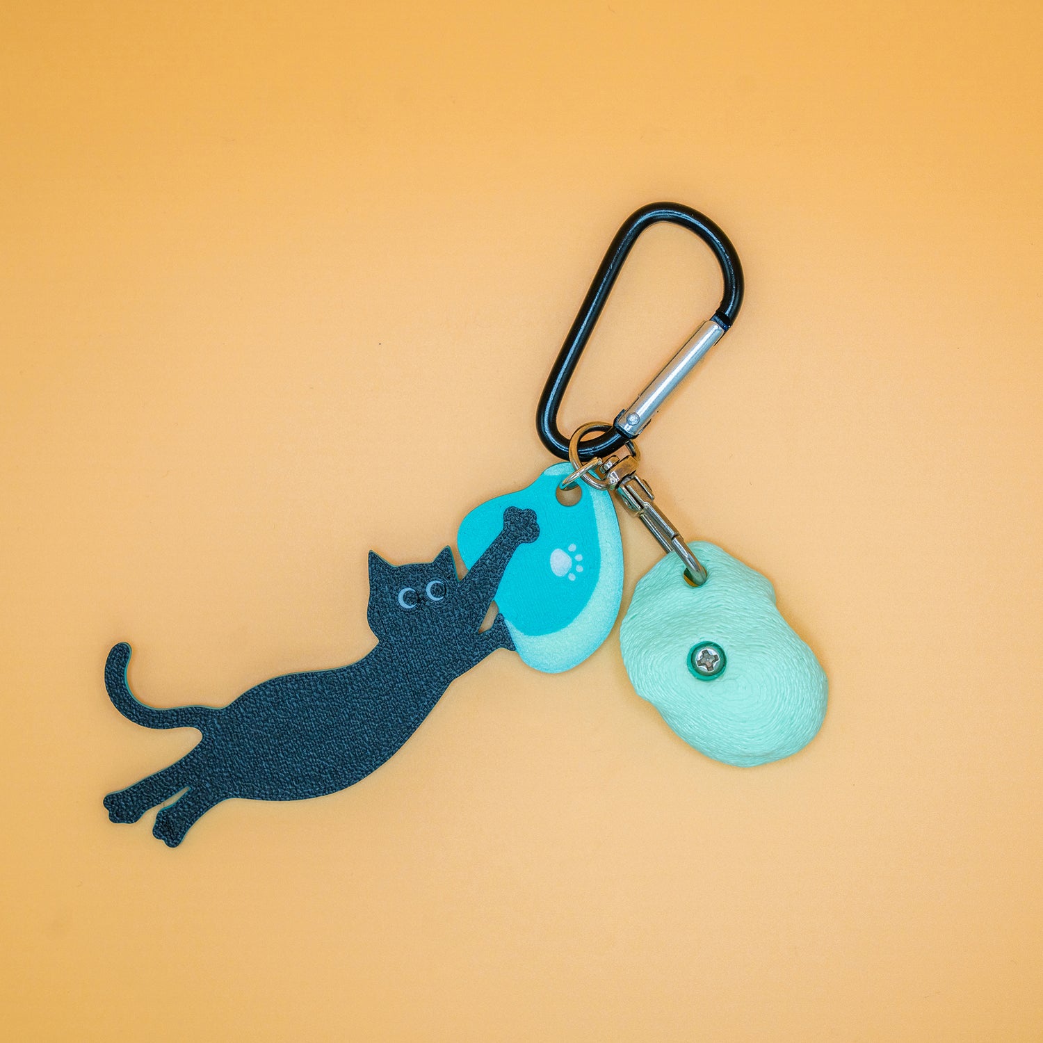 A playful cat mid-dyno on a keychain – perfect for climbers who love big moves and bold sends. Designed by Non Vertical Lab.