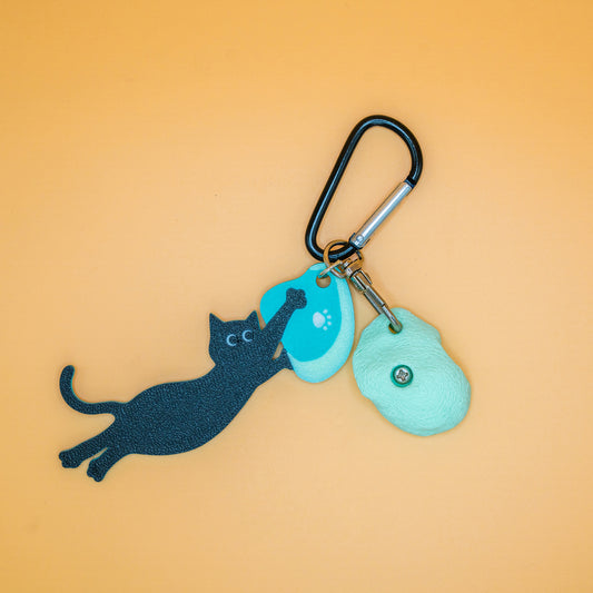 A playful cat mid-dyno on a keychain – perfect for climbers who love big moves and bold sends. Designed by Non Vertical Lab.