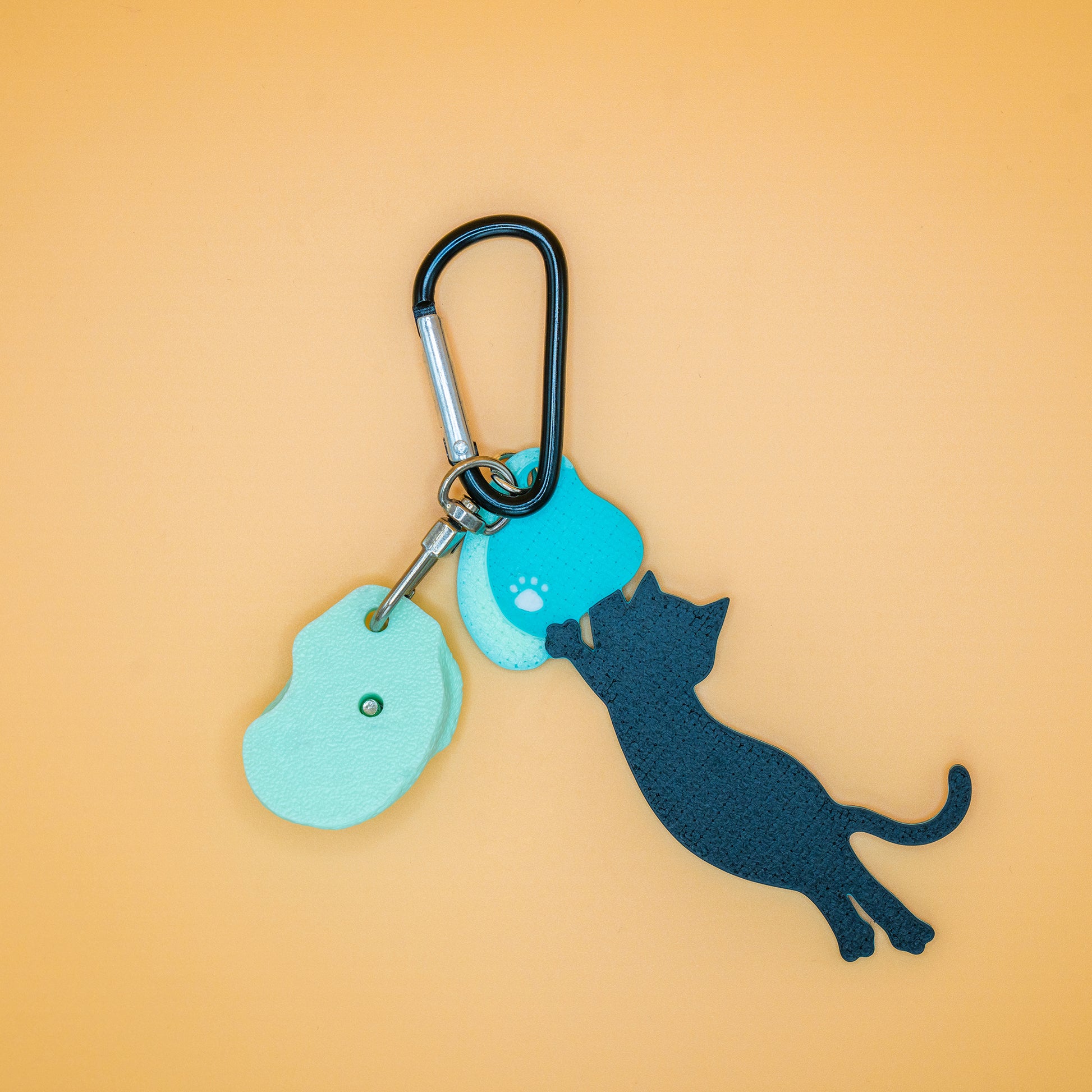 A playful cat mid-dyno on a keychain – perfect for climbers who love big moves and bold sends. Designed by Non Vertical Lab.