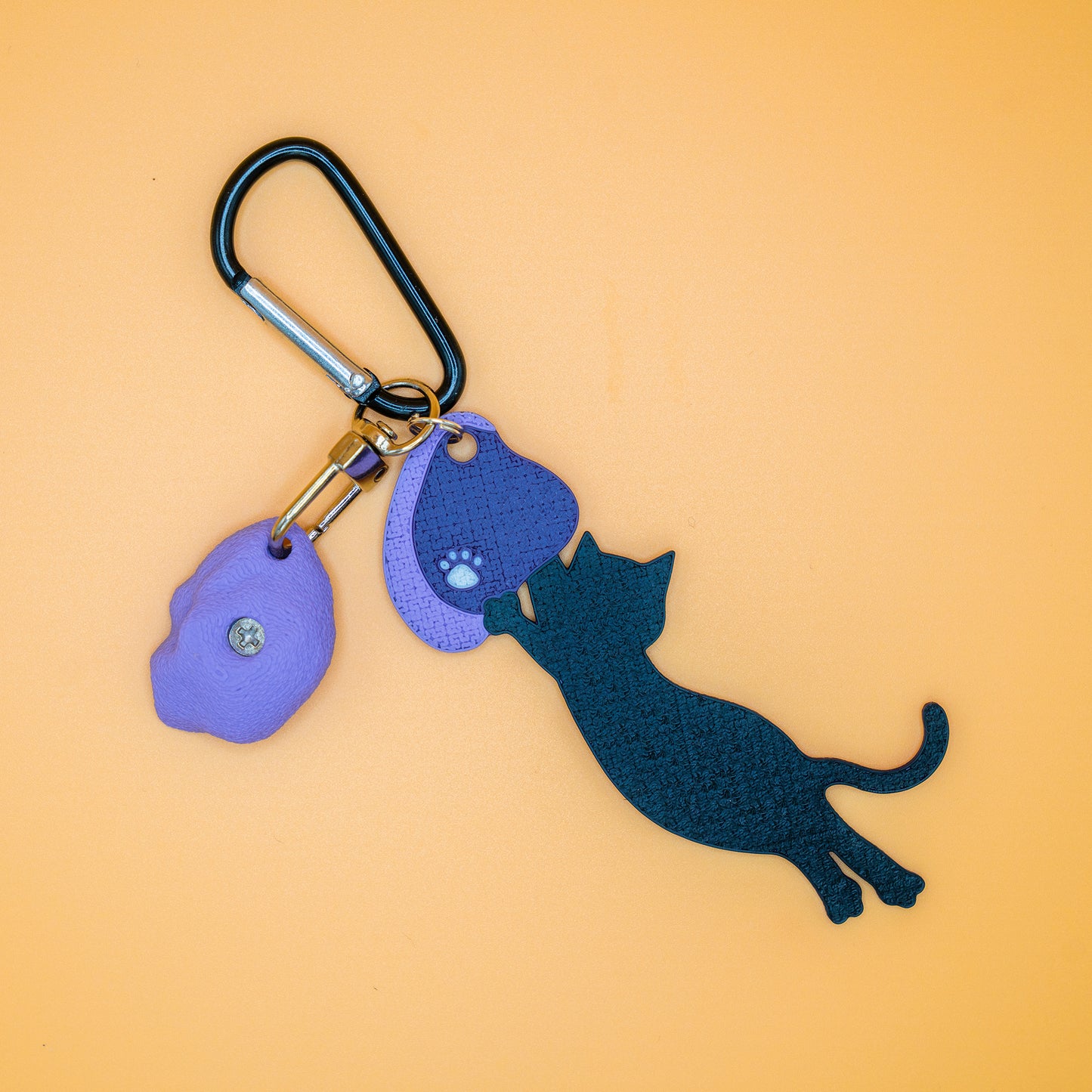 A playful cat mid-dyno on a keychain – perfect for climbers who love big moves and bold sends. Designed by Non Vertical Lab.