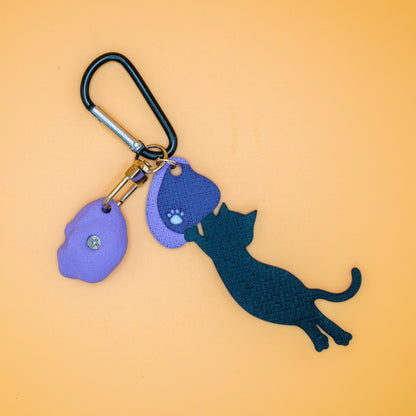 A playful cat mid-dyno on a keychain – perfect for climbers who love big moves and bold sends. Designed by Non Vertical Lab.