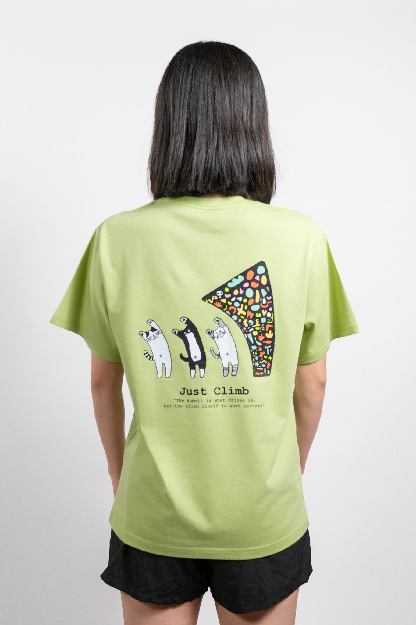 “Just Climb” graphic T-shirt featuring a cute cat and climbing elements – a fun and bold gift for rock climbers.