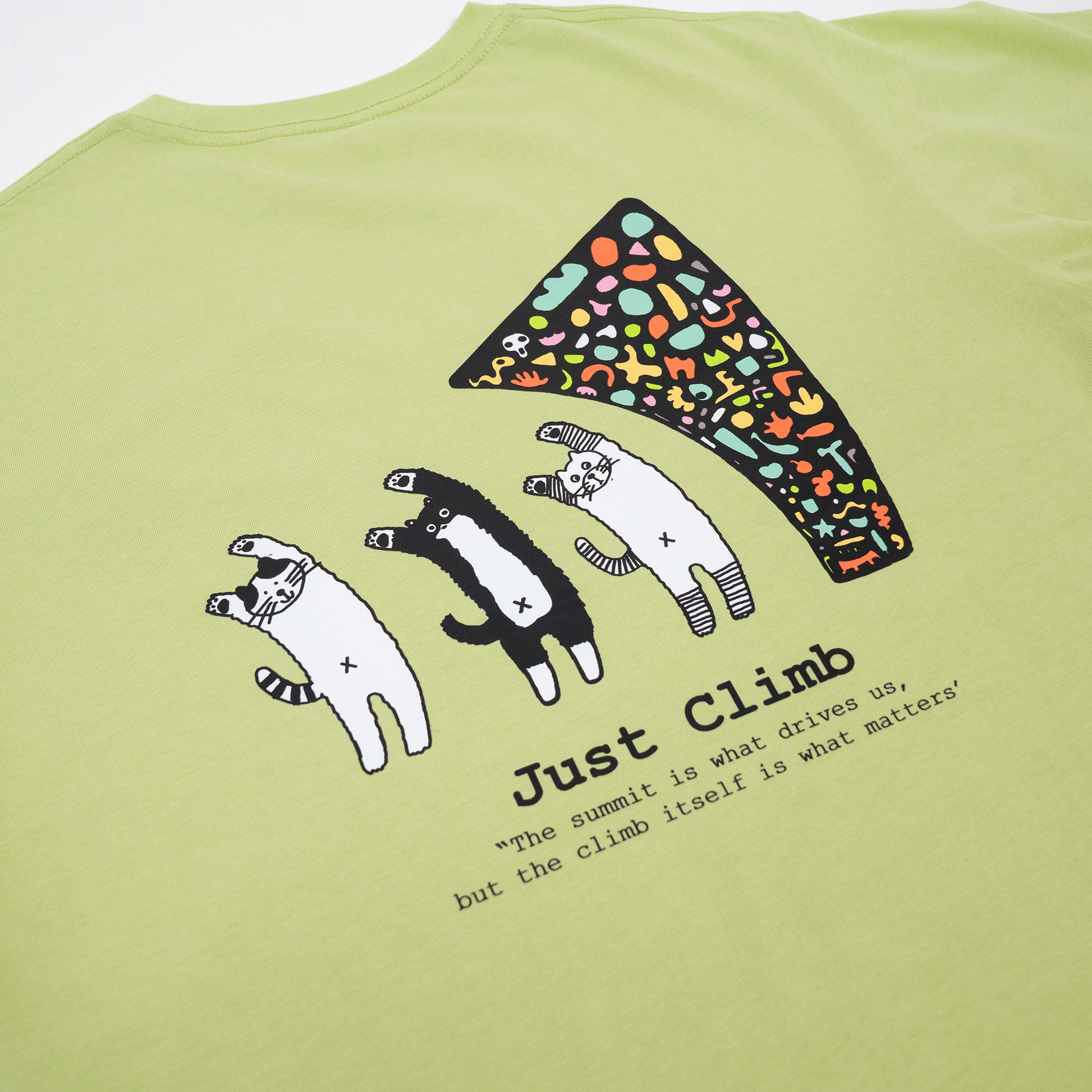 “Just Climb” graphic T-shirt featuring a cute cat and climbing elements – a fun and bold gift for rock climbers.