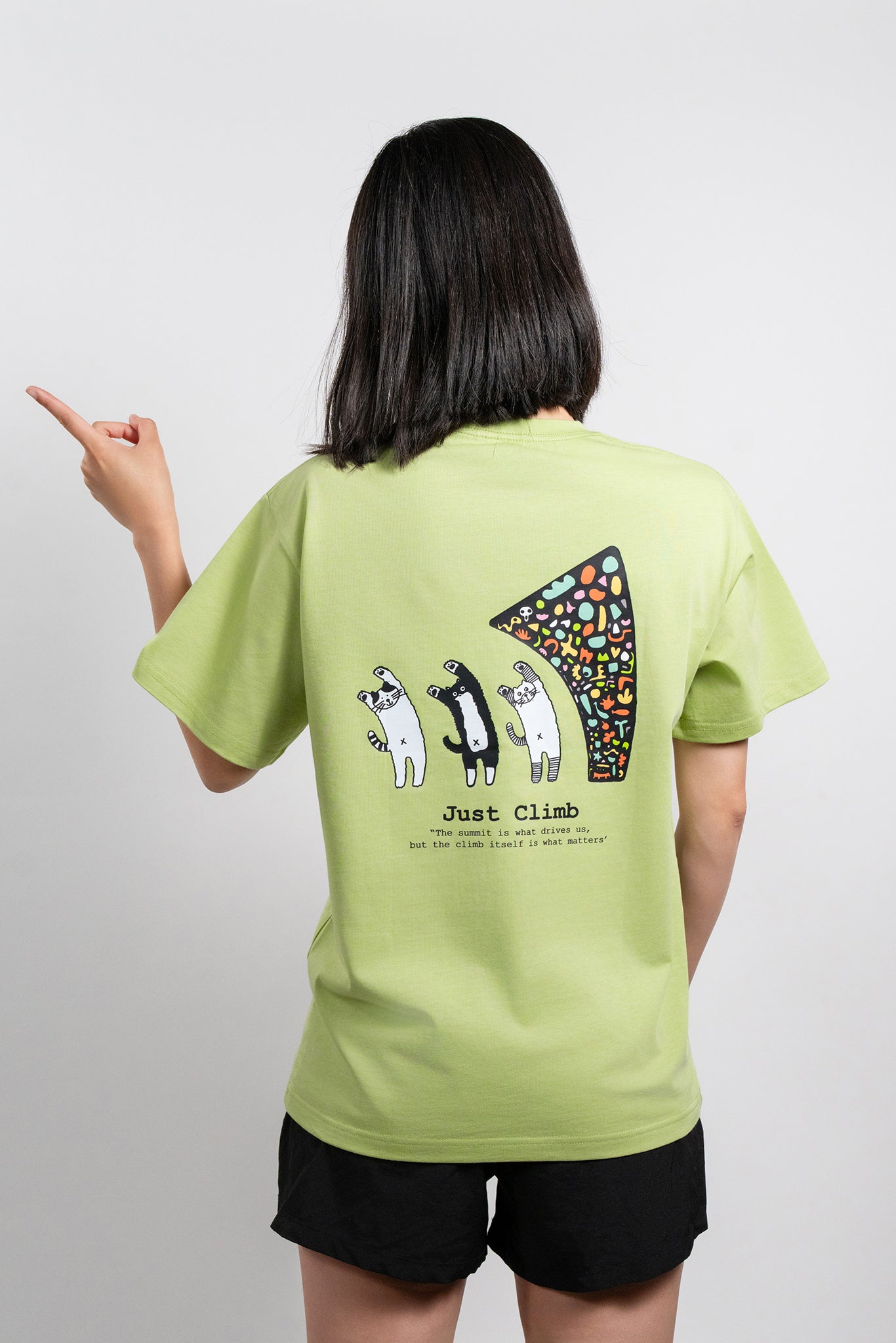 “Just Climb” graphic T-shirt featuring a cute cat and climbing elements – a fun and bold gift for rock climbers.