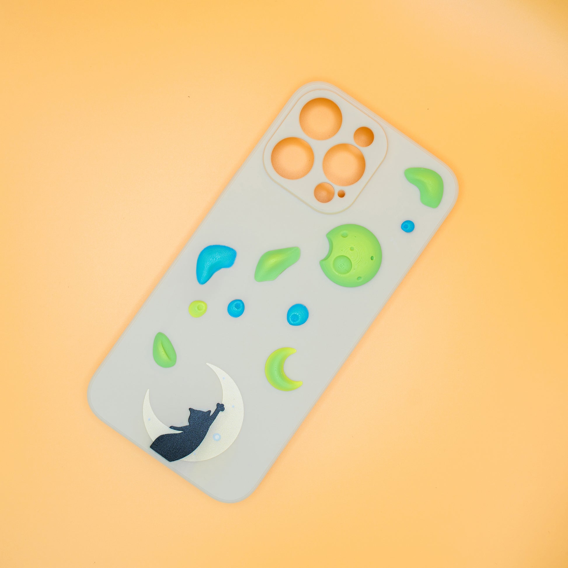 A black cat reaching up from a moon toward floating climbing holds – printed on a playful iPhone case, designed by Non Vertical Lab. A fun and thoughtful gift for climbers, cat lovers, and anyone who needs a little extra grip in life.