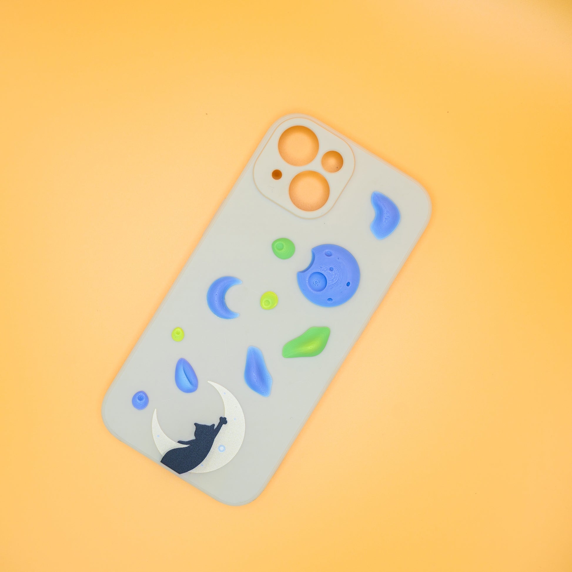 A black cat reaching up from a moon toward floating climbing holds – printed on a playful iPhone case, designed by Non Vertical Lab. A fun and thoughtful gift for climbers, cat lovers, and anyone who needs a little extra grip in life.
