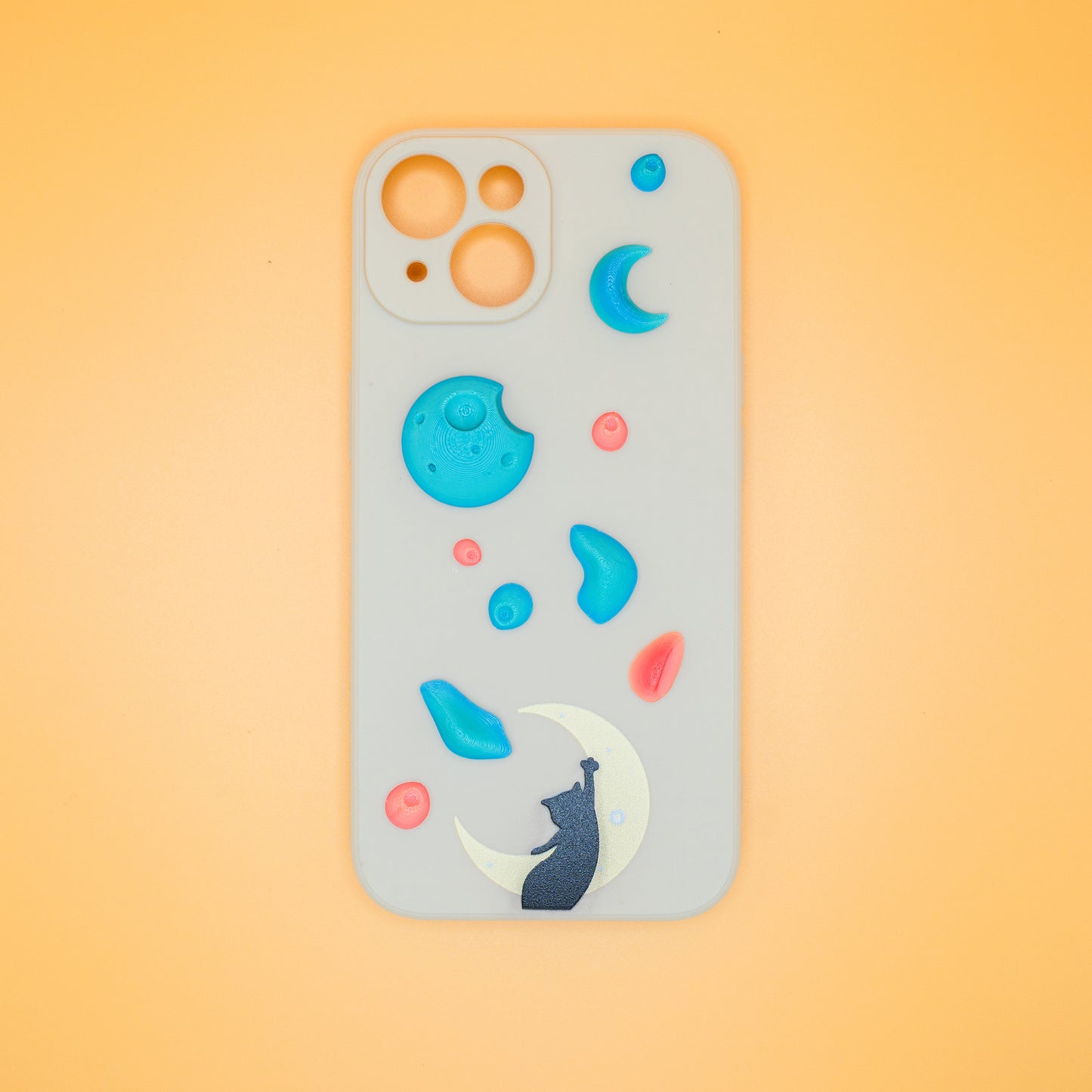 A black cat reaching up from a moon toward floating climbing holds – printed on a playful iPhone case, designed by Non Vertical Lab. A fun and thoughtful gift for climbers, cat lovers, and anyone who needs a little extra grip in life.